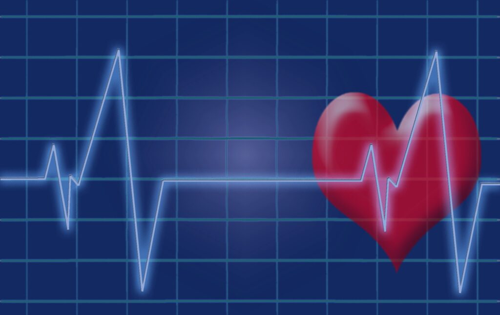 EKG-Linien und ein rotes Herz im Hintergrund